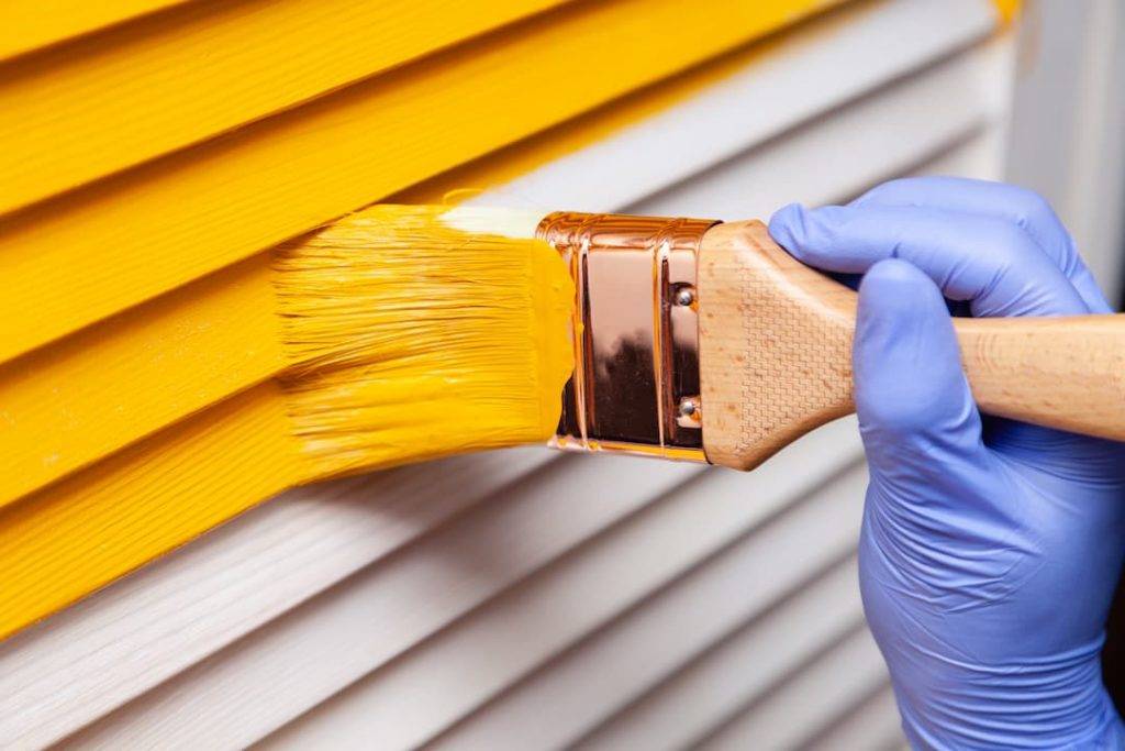 Painting A Home Exterior In Bright Yellow